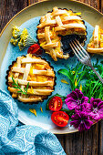 Small pumpkin quiches with pastry lattice crust