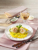 Pike-perch and white cabbage rolls on saffron risotto