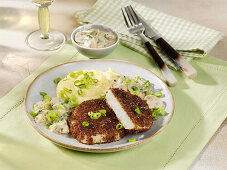 Celery escalope with a pumpernickel coating served with mushroom sauce and polenta