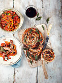 Grilled sausage wheels with sage and pepperonata