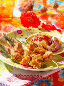 Chicken and pepper skewers on rosemary sprigs