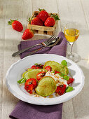 Mini herb pancakes with strawberries