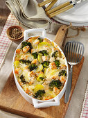 Potato casserole with salmon and broccoli