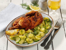 Roasted chicken with potato and cucumber salad