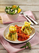 Chive crêpes with turkey filling and minced meat sauce