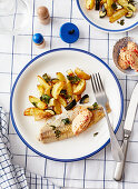 Pike-perch fillets with potato-zucchini vegetables and tomato butter