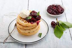 Waffles with cherry compote and vanilla ice cream