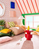 Comfortable armchair in colorful room with cheery wallpaper