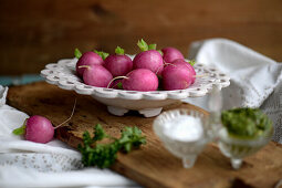 Blanched radishes in a decorative bowl with herb chimichurri