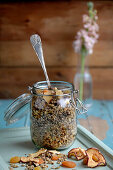 Homemade granola muesli with dried fruits in an ironing jar
