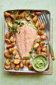 One-pan salmon with watercress stuffing, served with parmesan potatoes