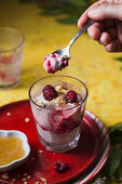 Fresh raspberries with whipped cream, honey, and toasted oats (cranachan)