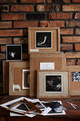 Black and white photos glued onto the back of picture frames