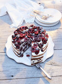 Poppy-seed cake with mascarpone-quark cream and cherries