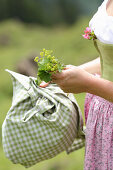 Woman collecting medicinal herbs