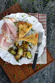 Potato tortilla with Christmas ham and roasted Brussels sprouts (using leftovers)
