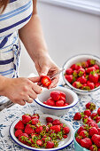 Chop fresh strawberries for jam