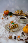 Autumnal nougat-vanilla roll decorated with pumpkin