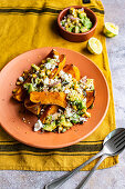 Butternut squash wedges with spicy corn-avocado salsa