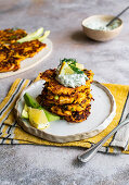 Gluten-free butternut squash hash browns served with herb cream cheese and avocado