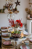 Christmas dining table with cake and bouquet of amaryllis