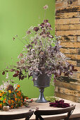 Decorative bouquet of dried flowers in pedestal vase