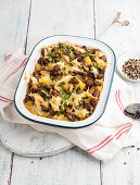 Vegan potato bake with peas and spicy soya chunks, topped with plant-based cheese substitute