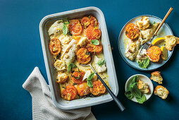 Hake with tomatoes and basil from the oven