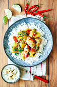 Spicy vindaloo with chicken and cashew nuts on rice