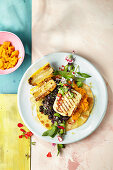 Pumpkin tostadas with a bean medley and roasted halloumi
