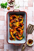 Roasted pumpkin slices with fruity sauce and walnuts