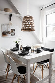 White kitchen table with black and grey tableware