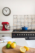 Gas stove top and oven, tiled backsplash