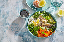 Poke bowl with trout and quail eggs