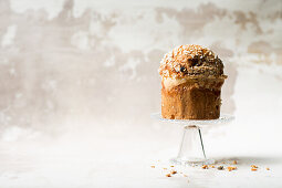 A panettone on a glass stand