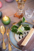 Christmas table set with crystal glasses and candle