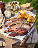 Grilled pork ribs with sweet chili glaze and corn on the cob