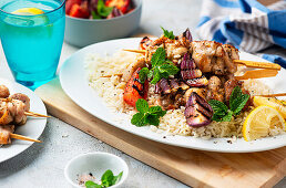 Chicken skewers with grilled vegetables and rice