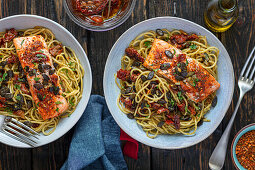 Spaghetti with baked salmon, pesto, and dried tomatoes