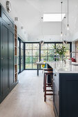 Open kitchen, in the background dining area in front of sliding glass doors