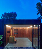 A view into a spa area with wooden panelling at dusk