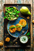 Tyrolean cheese dumplings with pear field salad and walnuts