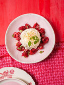 Coconut rice on marinated raspberries