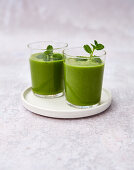 Green apple smoothie with kiwi, banana, cucumber and spinach