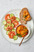 Red lentil spread with tomatoes and cucumber