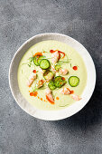 Cucumber and almond soup with shrimp, mini cucumbers, dill and spiced olive oil