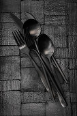 Black cutlery on a black background