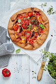 Fruity tomato galette with plums