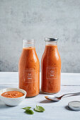Homemade tomato sauce made from roasted tomatoes in glass bottles