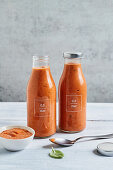 Homemade tomato sauce from roasted tomatoes in glass bottles